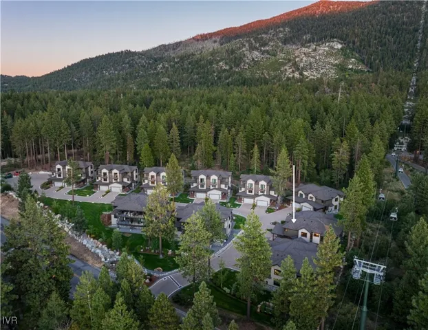 a view of a town with mountains in the background