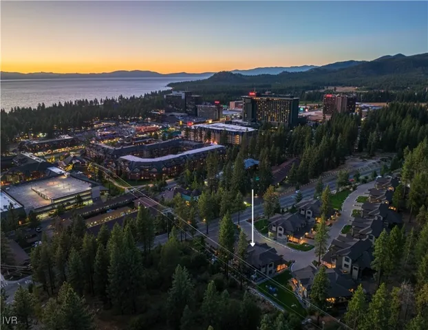 a sign board with a play ground in the back