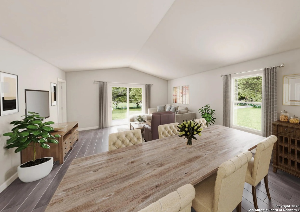 104 Sutton Place Uvalde, TX 78801 - Photo 4 of 4 a view of a dining room with furniture and wooden floor
