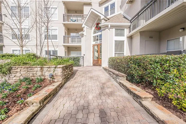 a view of a kitchen filled with furniture and a window