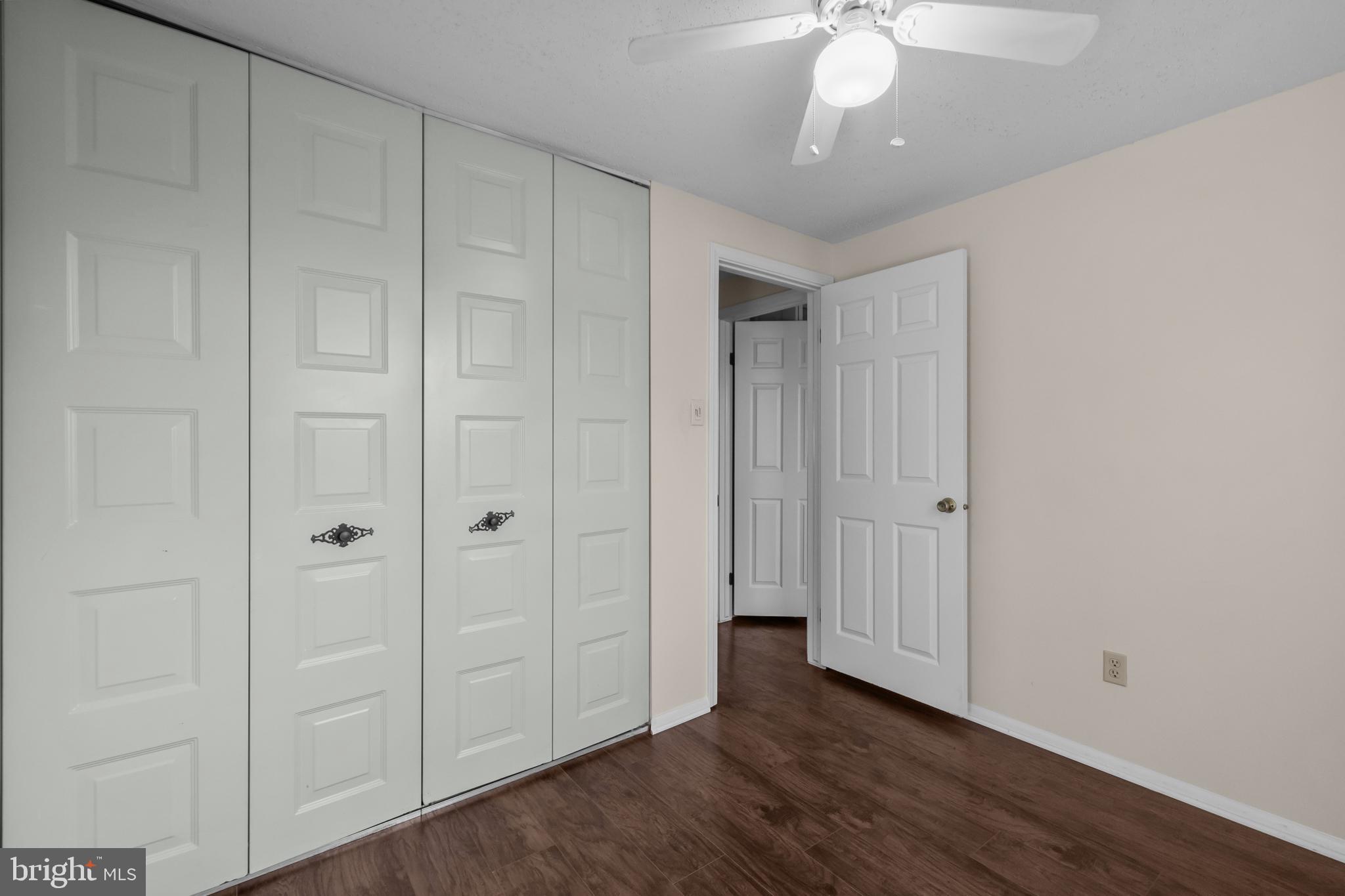 6832 Heatherway Court Alexandria, VA 22315 - Photo 16 of 37 a view of a hallway with wooden floor
