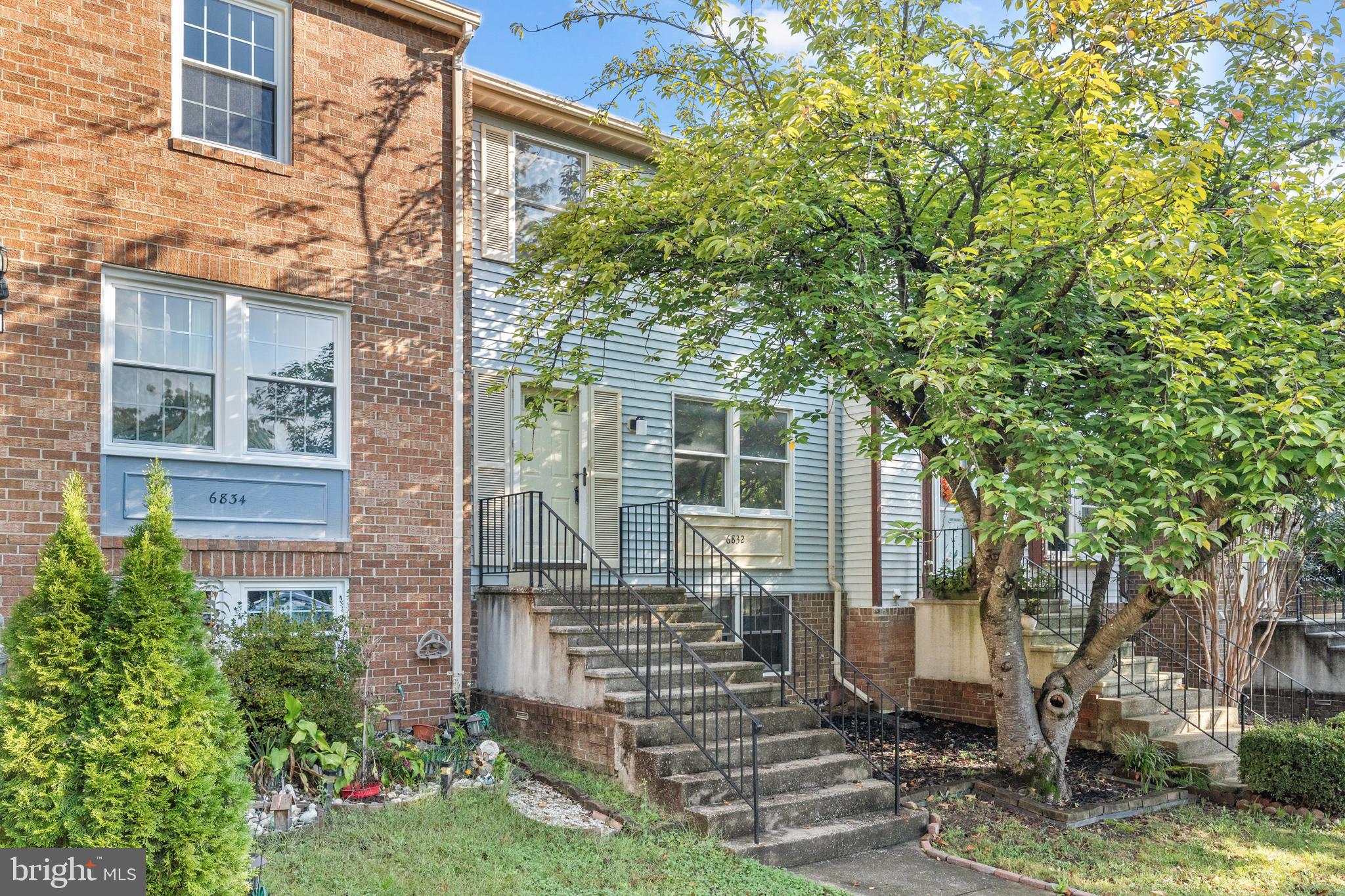 6832 Heatherway Court Alexandria, VA 22315 - Photo 2 of 37 a front view of a house with garden