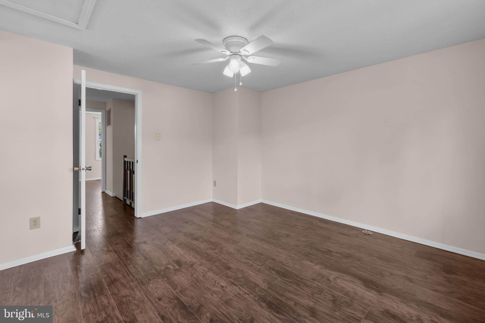 6832 Heatherway Court Alexandria, VA 22315 - Photo 21 of 37 a view of an empty room with wooden floor