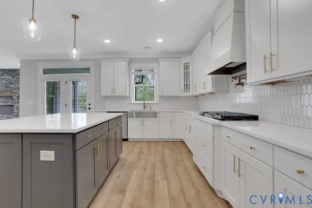 3951 Jett Court Gum Spring, VA 23065 - Photo 3 of 12 a kitchen with kitchen island granite countertop a sink a counter space appliances and cabinets