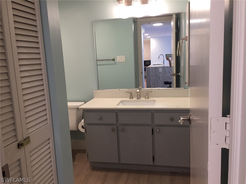 3170 Matecumbe Key Road, Unit 134 Punta Gorda, FL 33955 - Photo 12 of 41 a bathroom with a sink and a mirror