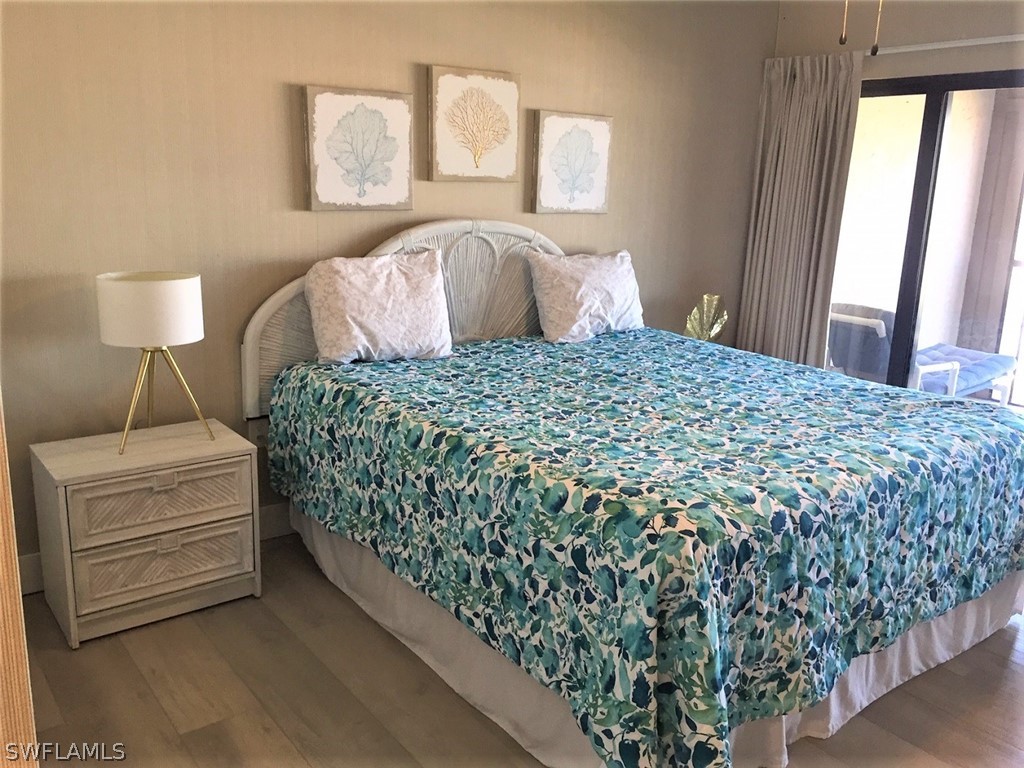 3170 Matecumbe Key Road, Unit 134 Punta Gorda, FL 33955 - Photo 13 of 41 a bedroom with a bed and a lamp