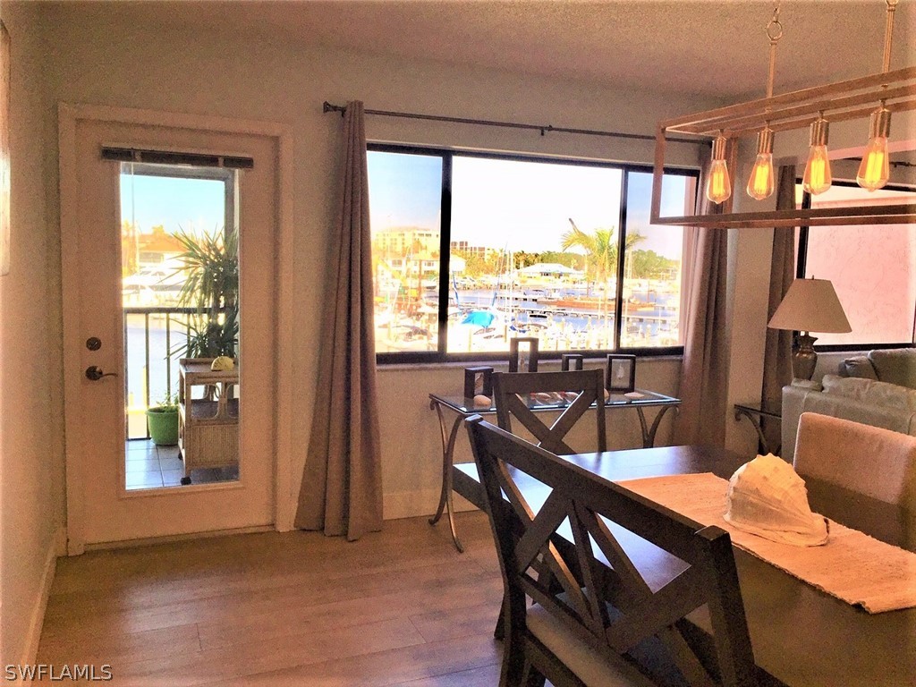 3170 Matecumbe Key Road, Unit 134 Punta Gorda, FL 33955 - Photo 18 of 41 a view of a dining room with furniture and a window