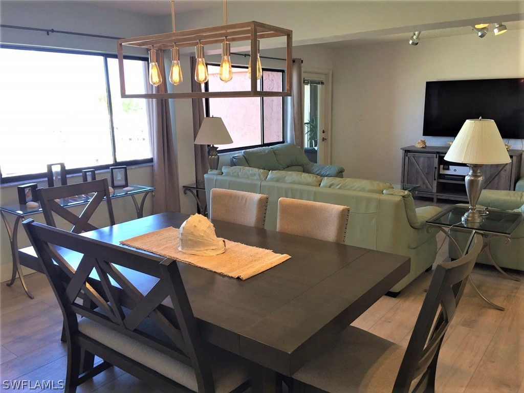 3170 Matecumbe Key Road, Unit 134 Punta Gorda, FL 33955 - Photo 19 of 41 a view of a dining room with furniture window and outside view
