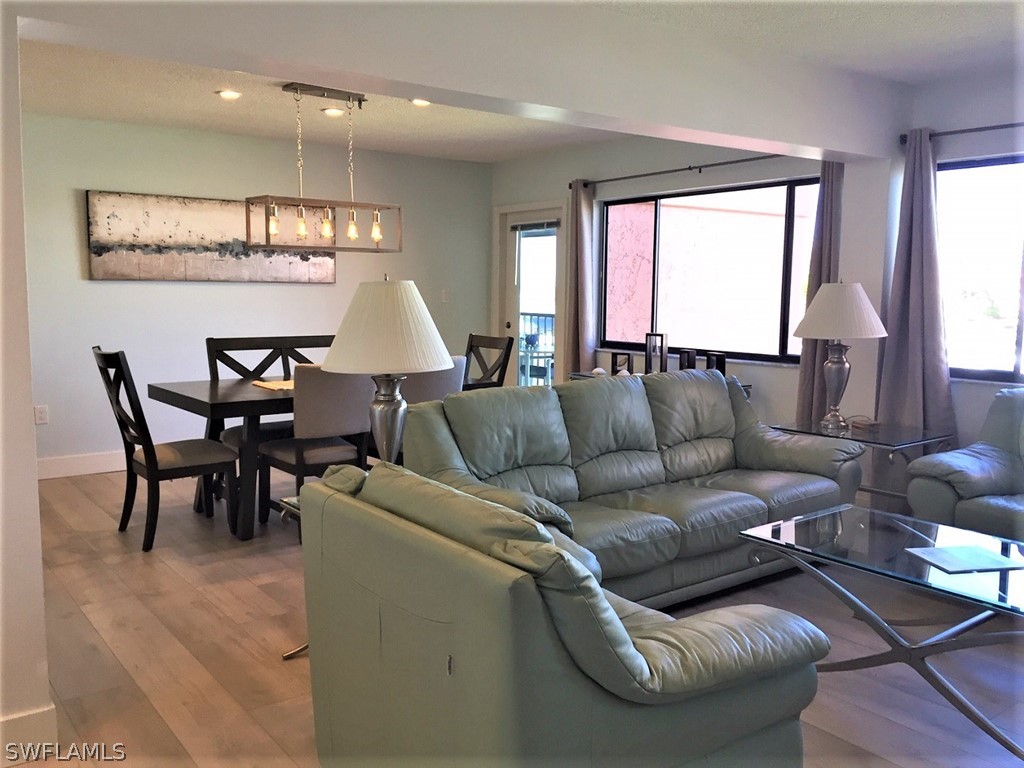 3170 Matecumbe Key Road, Unit 134 Punta Gorda, FL 33955 - Photo 21 of 41 a living room with furniture and a large window