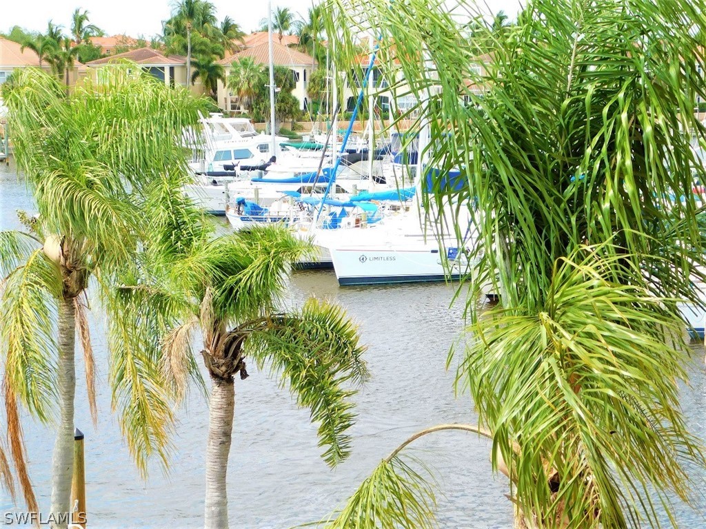 3170 Matecumbe Key Road, Unit 134 Punta Gorda, FL 33955 - Photo 29 of 41 a view of yard with swimming pool and sitting area