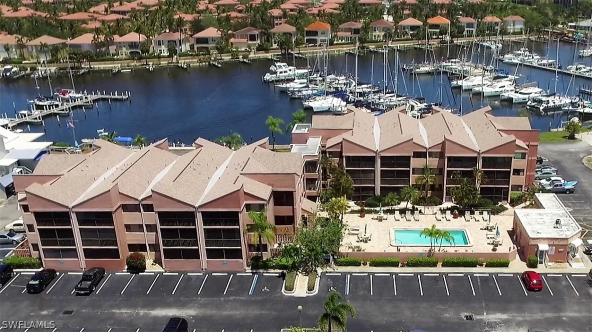 3170 Matecumbe Key Road, Unit 134 Punta Gorda, FL 33955 - Photo 35 of 41 a view of a lake with couches and city view