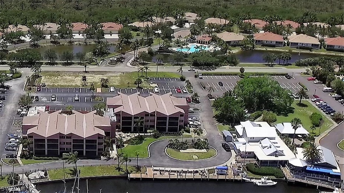 3170 Matecumbe Key Road, Unit 134 Punta Gorda, FL 33955 - Photo 4 of 41 a view of swimming pool and outdoor seating
