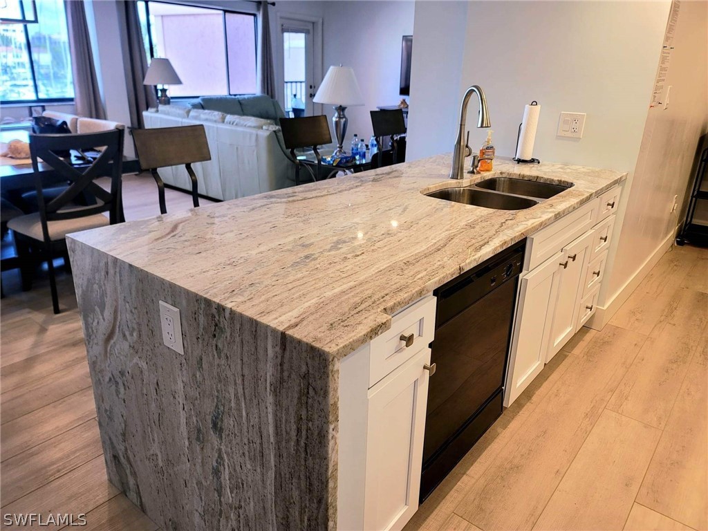 3170 Matecumbe Key Road, Unit 134 Punta Gorda, FL 33955 - Photo 7 of 41 a kitchen with a stove a sink and a refrigerator