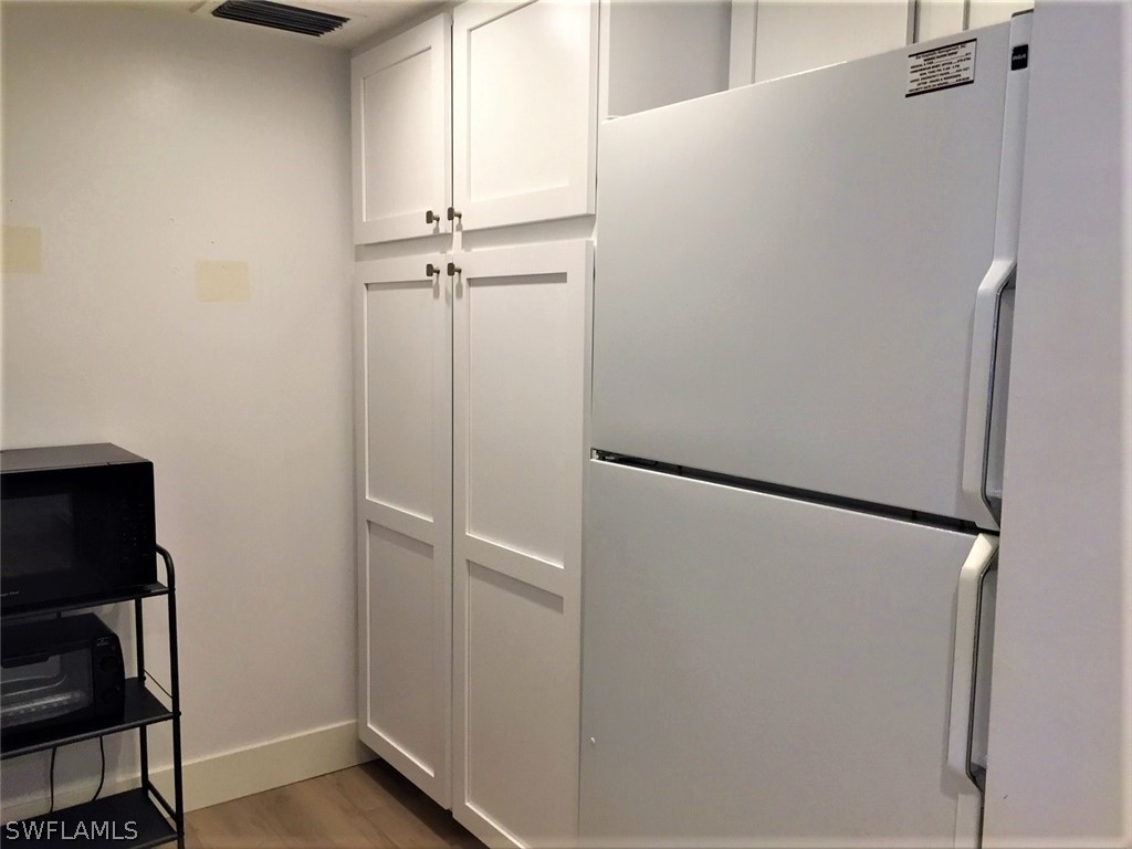 3170 Matecumbe Key Road, Unit 134 Punta Gorda, FL 33955 - Photo 9 of 41 a view of a closet with wooden floor