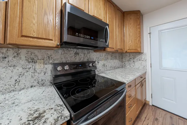 a kitchen with a stove and a microwave