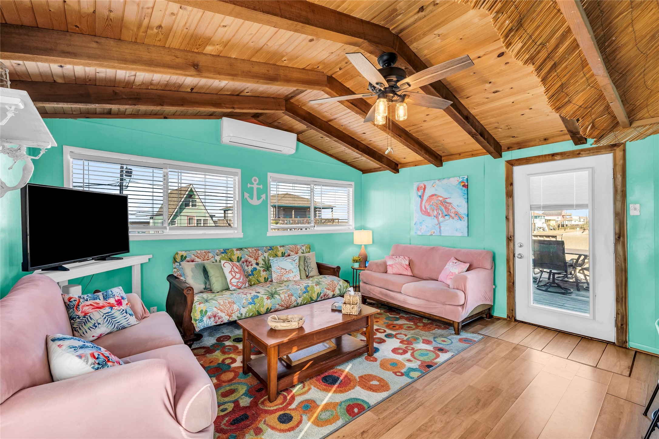 a living room with furniture and a flat screen tv