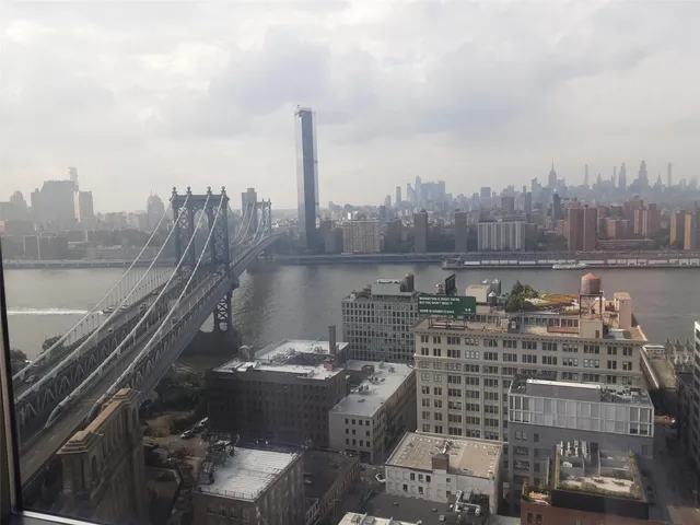 a view of a city with tall buildings