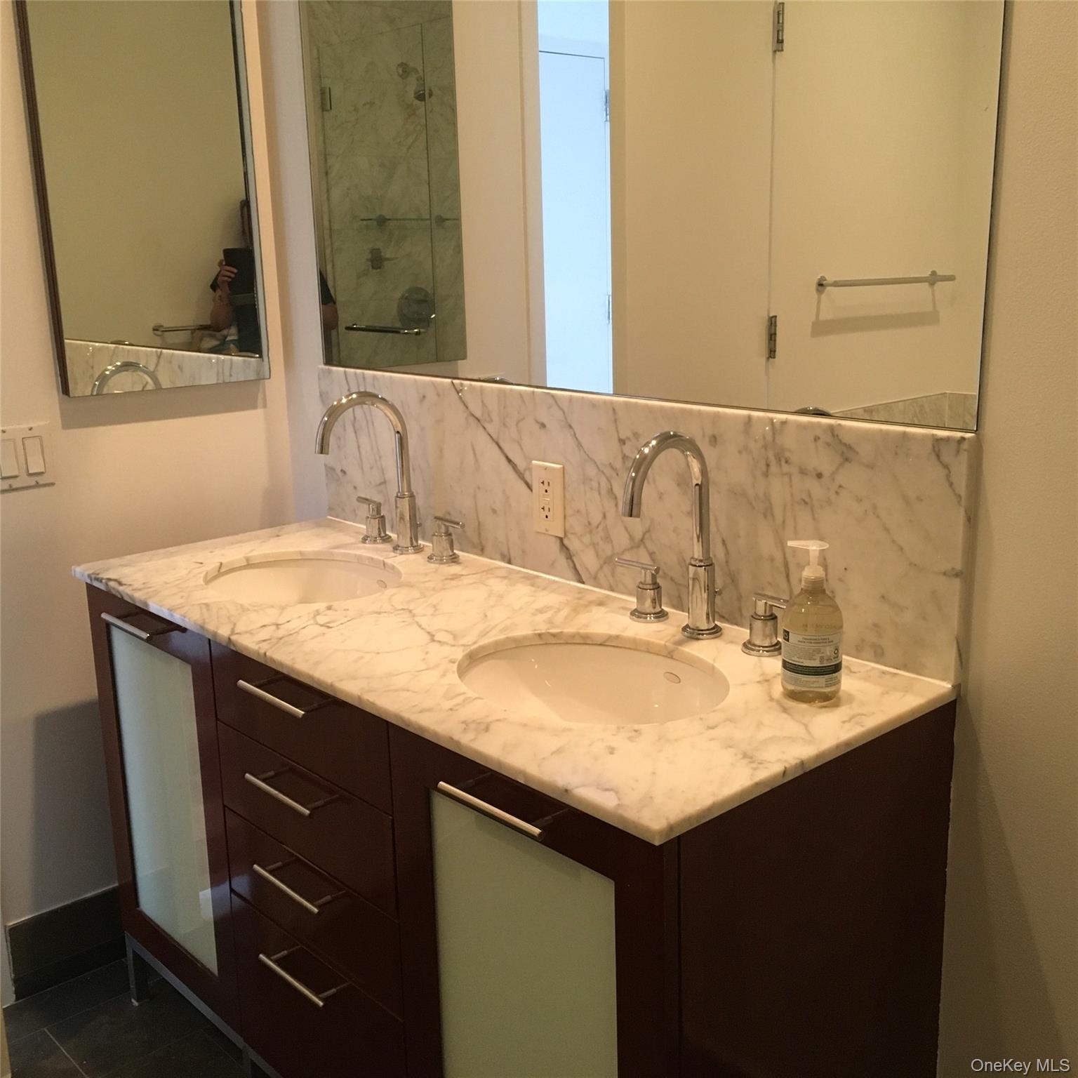 100 Jay Street, Unit 28B Brooklyn, NY 11201 - Photo 38 of 47 a bathroom with a granite countertop sink and a mirror