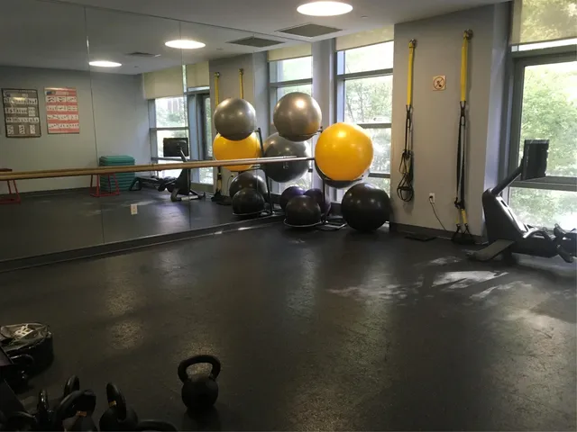 a living room with blue lights with furniture and fish tank