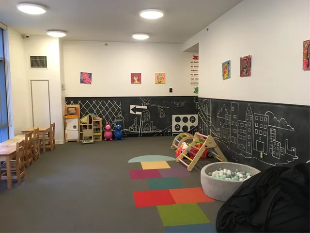 a living room with furniture and a dining table