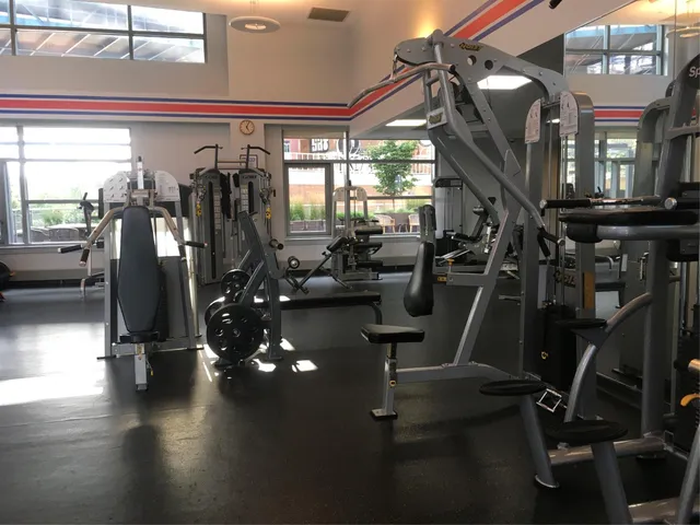 a room with gym equipment and a large window
