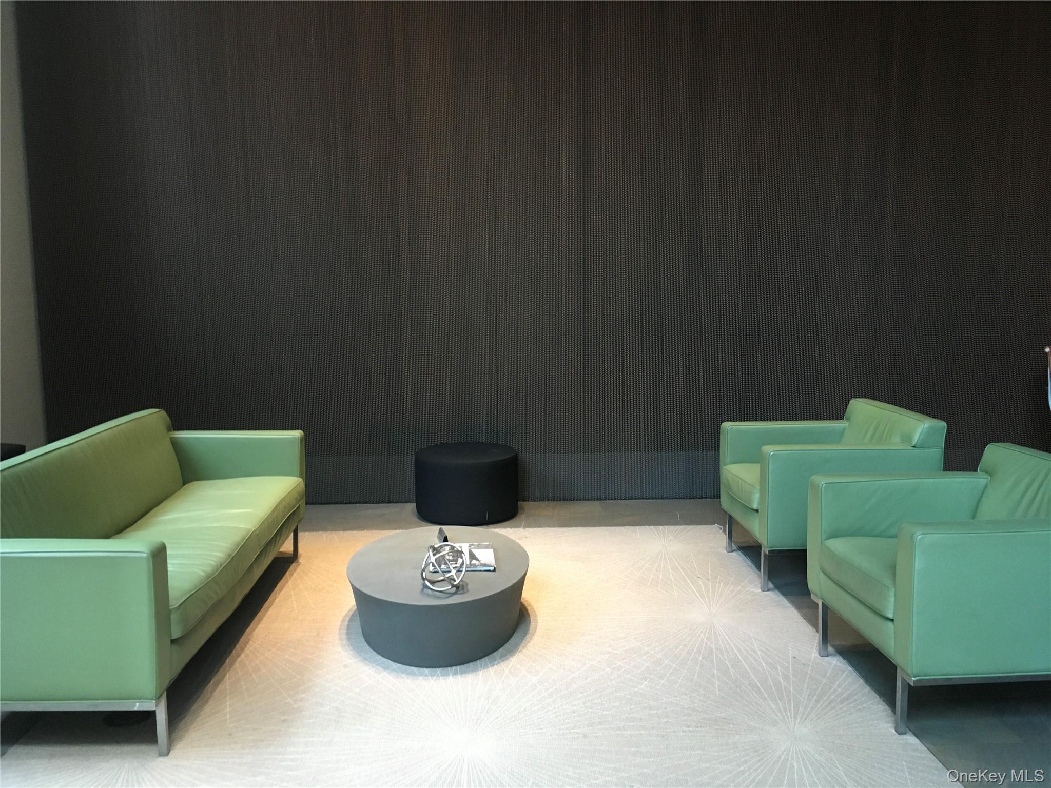 100 Jay Street, Unit 28B Brooklyn, NY 11201 - Photo 46 of 47 a living room with furniture and a wooden floor