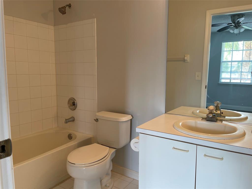 9914 Northwest 56th Place Coral Springs, FL 33076 - Photo 12 of 19 a bathroom with a sink a toilet and shower