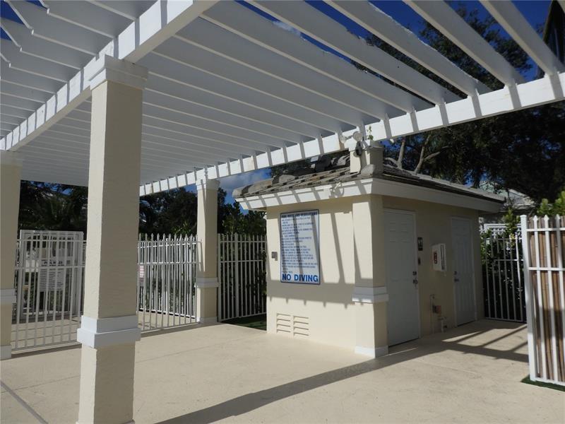 9914 Northwest 56th Place Coral Springs, FL 33076 - Photo 13 of 19 a view of a house with a porch