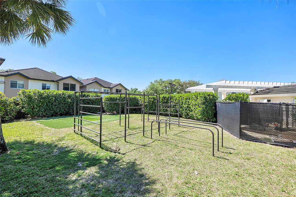 9914 Northwest 56th Place Coral Springs, FL 33076 - Photo 17 of 19 a view of a backyard