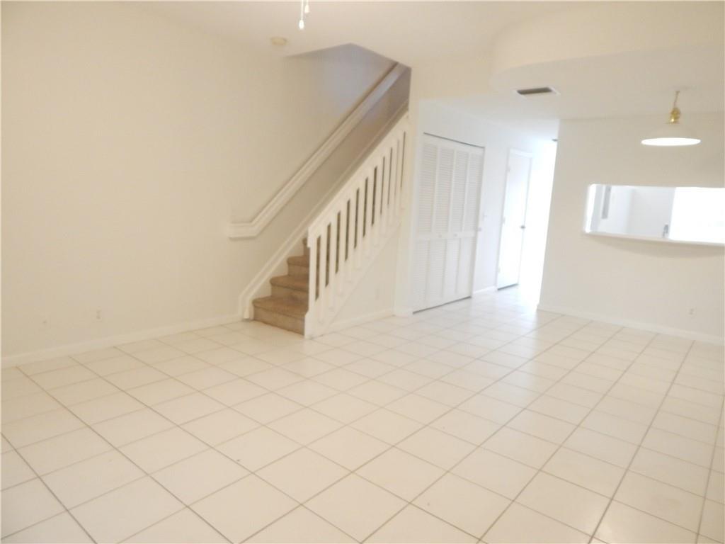 9914 Northwest 56th Place Coral Springs, FL 33076 - Photo 8 of 19 a view of entryway and hall with a window