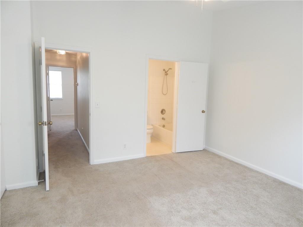 9914 Northwest 56th Place Coral Springs, FL 33076 - Photo 9 of 19 an empty room with windows