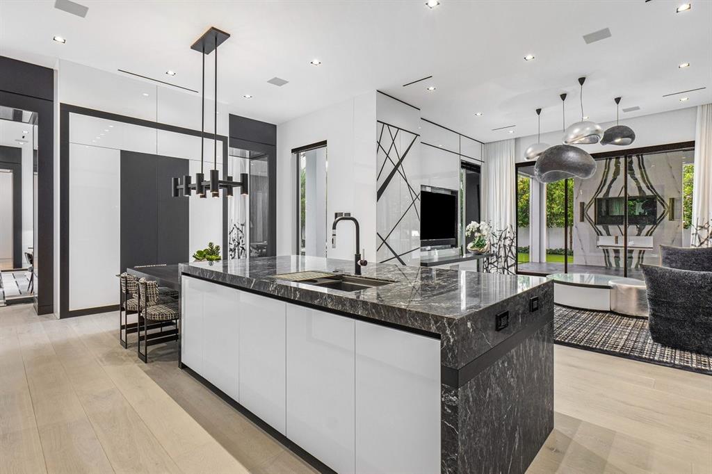 202 Northwest 7th Street Delray Beach, FL 33444 - Photo 17 of 100 a kitchen with stainless steel appliances kitchen island granite countertop a sink and a flat screen tv
