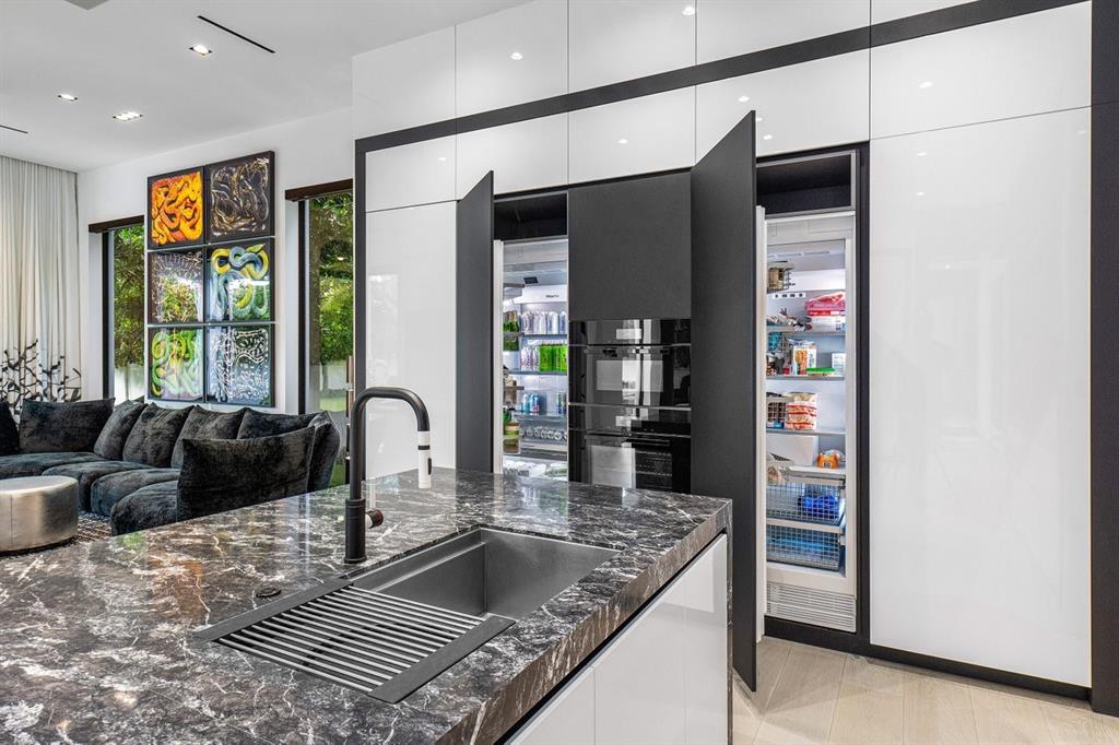 202 Northwest 7th Street Delray Beach, FL 33444 - Photo 19 of 100 a kitchen with stainless steel appliances granite countertop a refrigerator and a sink