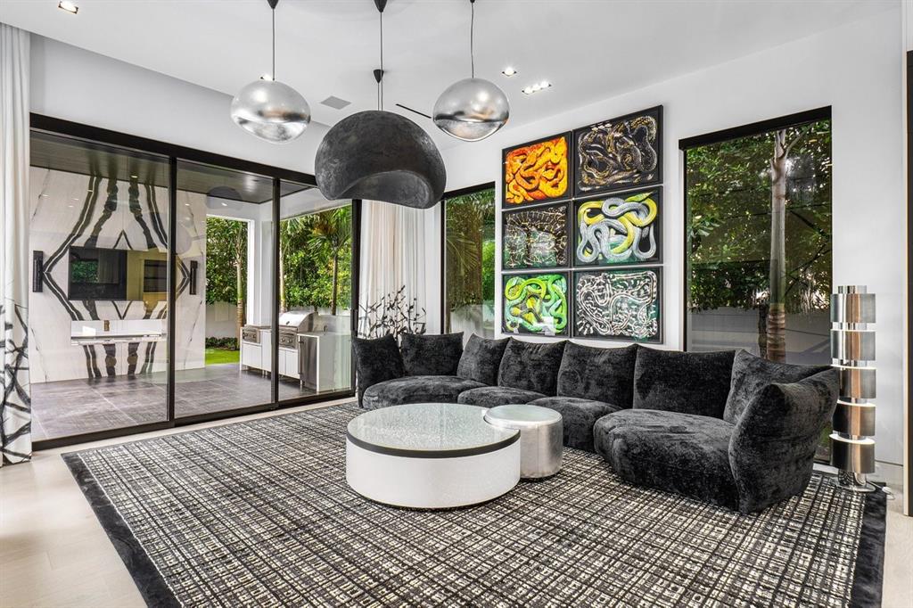 202 Northwest 7th Street Delray Beach, FL 33444 - Photo 22 of 100 a living room with furniture a flat screen tv and a large window