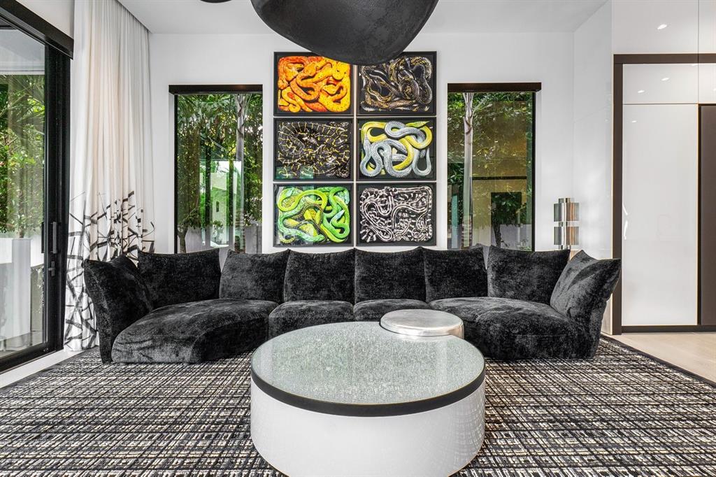 202 Northwest 7th Street Delray Beach, FL 33444 - Photo 23 of 100 a living room with furniture and a floor to ceiling window