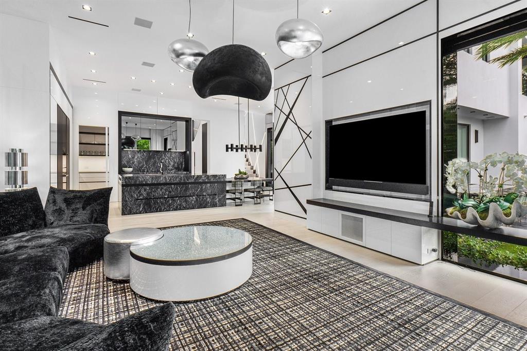 202 Northwest 7th Street Delray Beach, FL 33444 - Photo 24 of 100 a living room with furniture a flat screen tv and a fireplace