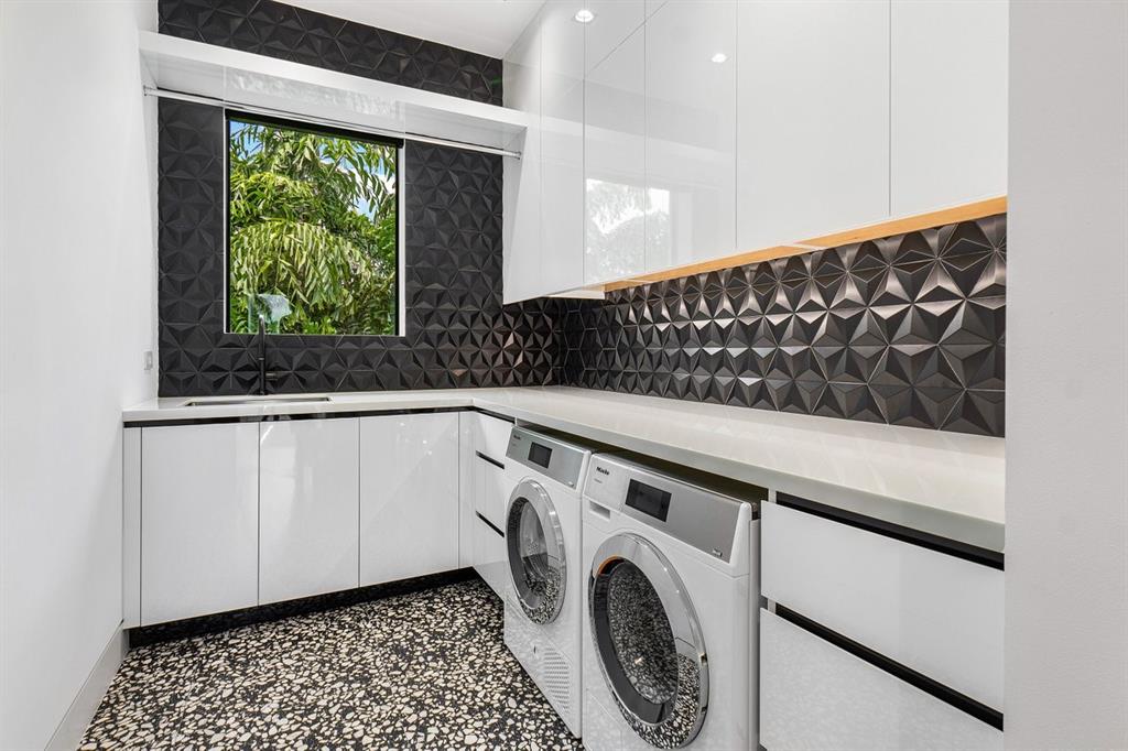 202 Northwest 7th Street Delray Beach, FL 33444 - Photo 35 of 100 a utility room with dryer and washer