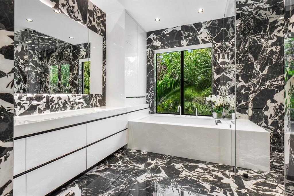 202 Northwest 7th Street Delray Beach, FL 33444 - Photo 36 of 100 a bathroom with a bathtub and a large window