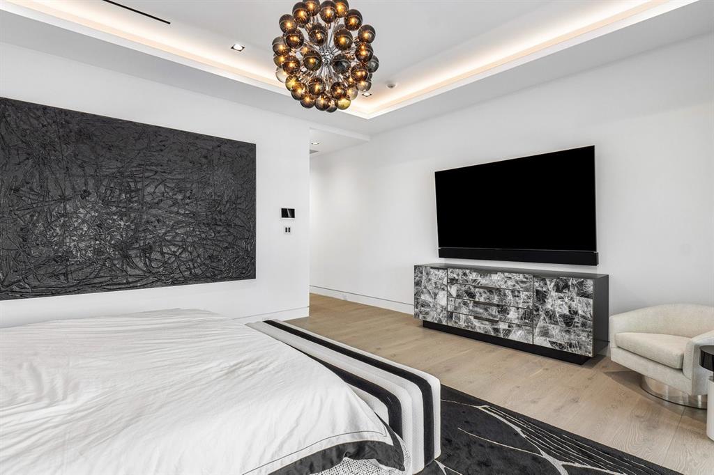 202 Northwest 7th Street Delray Beach, FL 33444 - Photo 43 of 100 a bedroom with a bed and a flat screen tv