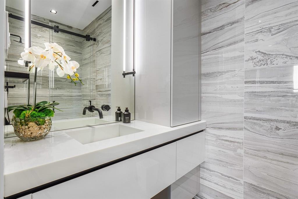 202 Northwest 7th Street Delray Beach, FL 33444 - Photo 56 of 100 a bathroom with a sink and a shower