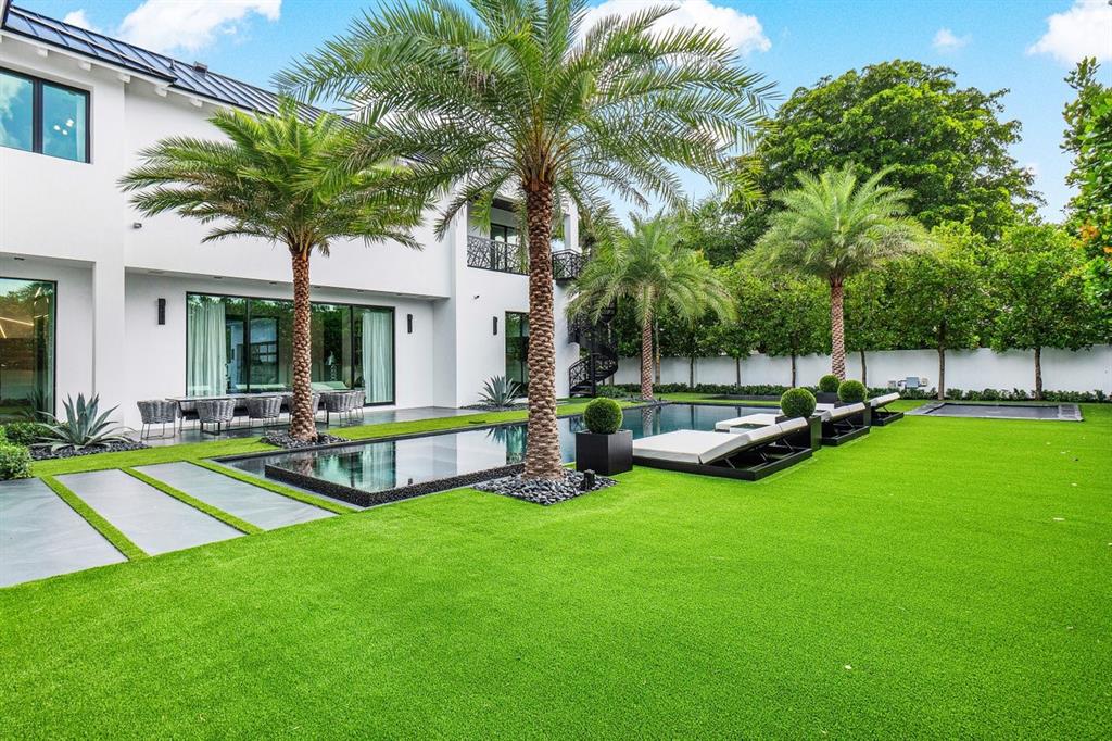 202 Northwest 7th Street Delray Beach, FL 33444 - Photo 71 of 100 a view of a house with swimming pool and a yard