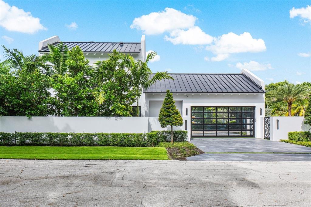 202 Northwest 7th Street Delray Beach, FL 33444 - Photo 81 of 100 a view of a house with a yard and a large tree