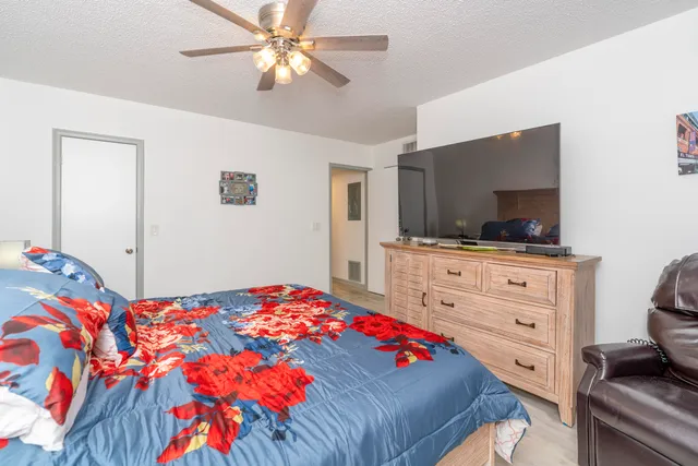 a bathroom with a sink mirror vanity and toilet