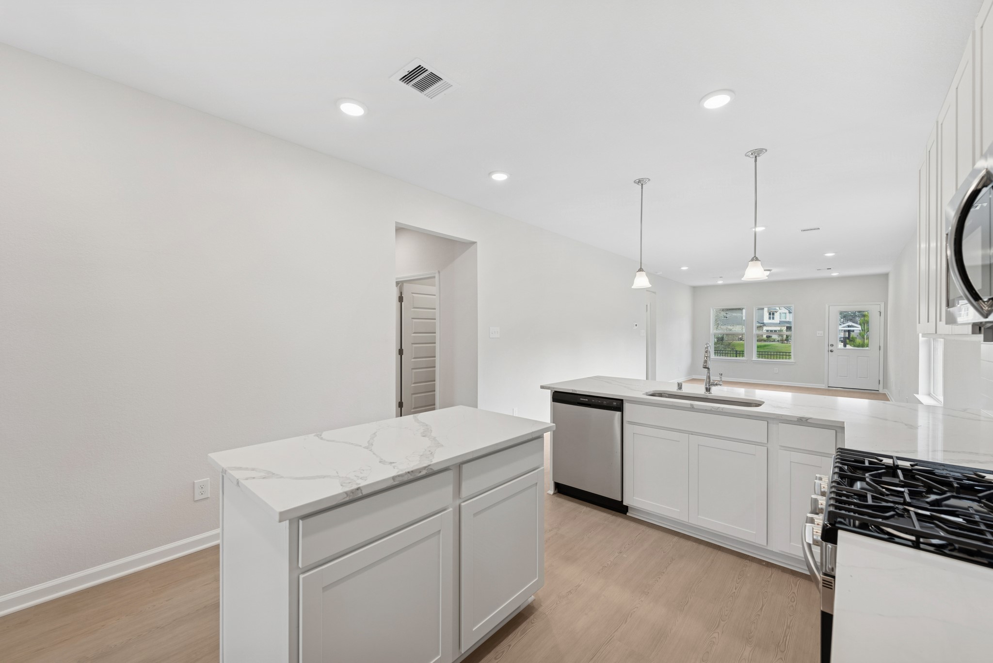 537 Stone Placa Trail Pattison, TX 77423 - Photo 5 of 28 a kitchen with a sink stove and cabinets