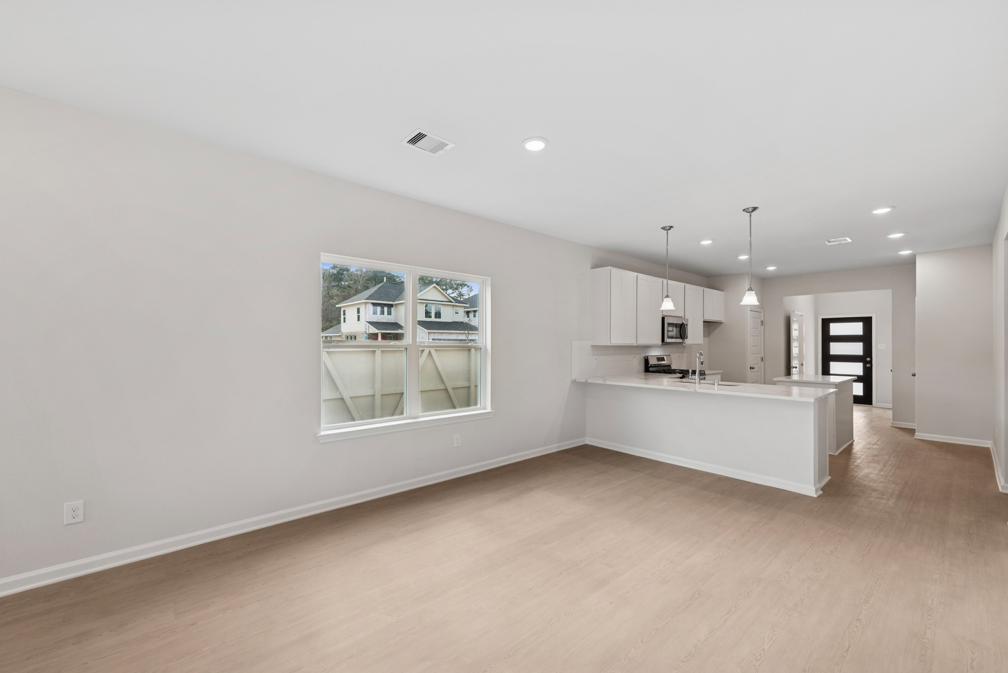 537 Stone Placa Trail Pattison, TX 77423 - Photo 8 of 28 a view of kitchen and hall with large window