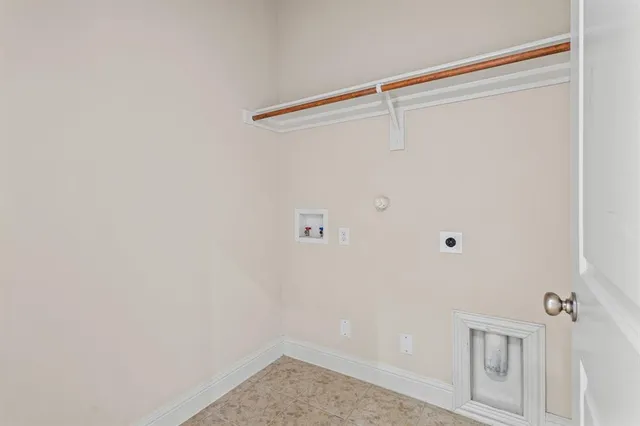 a view of staircase with white walls