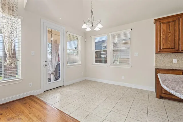 an empty room with windows and entrance