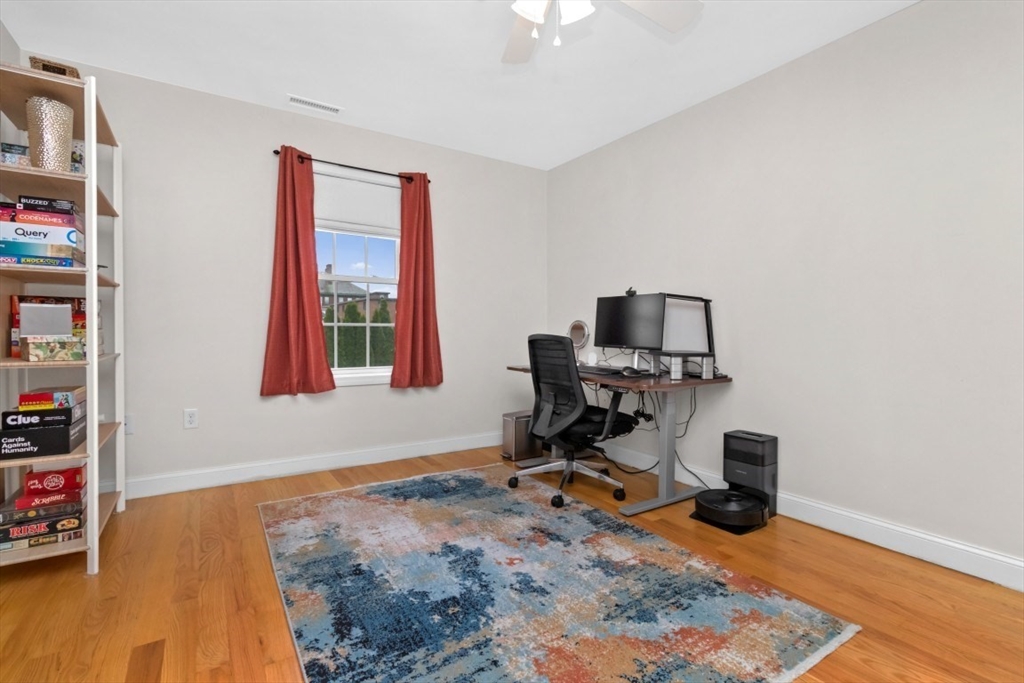 29 Spruce Street, Unit 23 Waltham, MA 02453 - Photo 15 of 26 a view of a workspace with furniture and a window