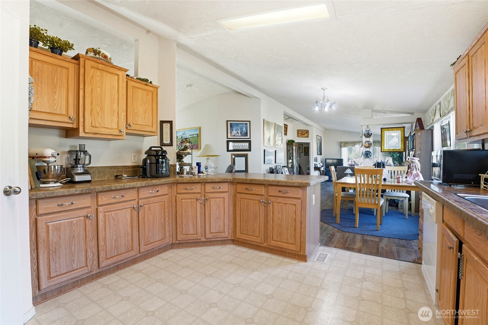 1003 Lord Street Kelso, WA 98626 - Photo 15 of 29 a kitchen with sink cabinets and living room