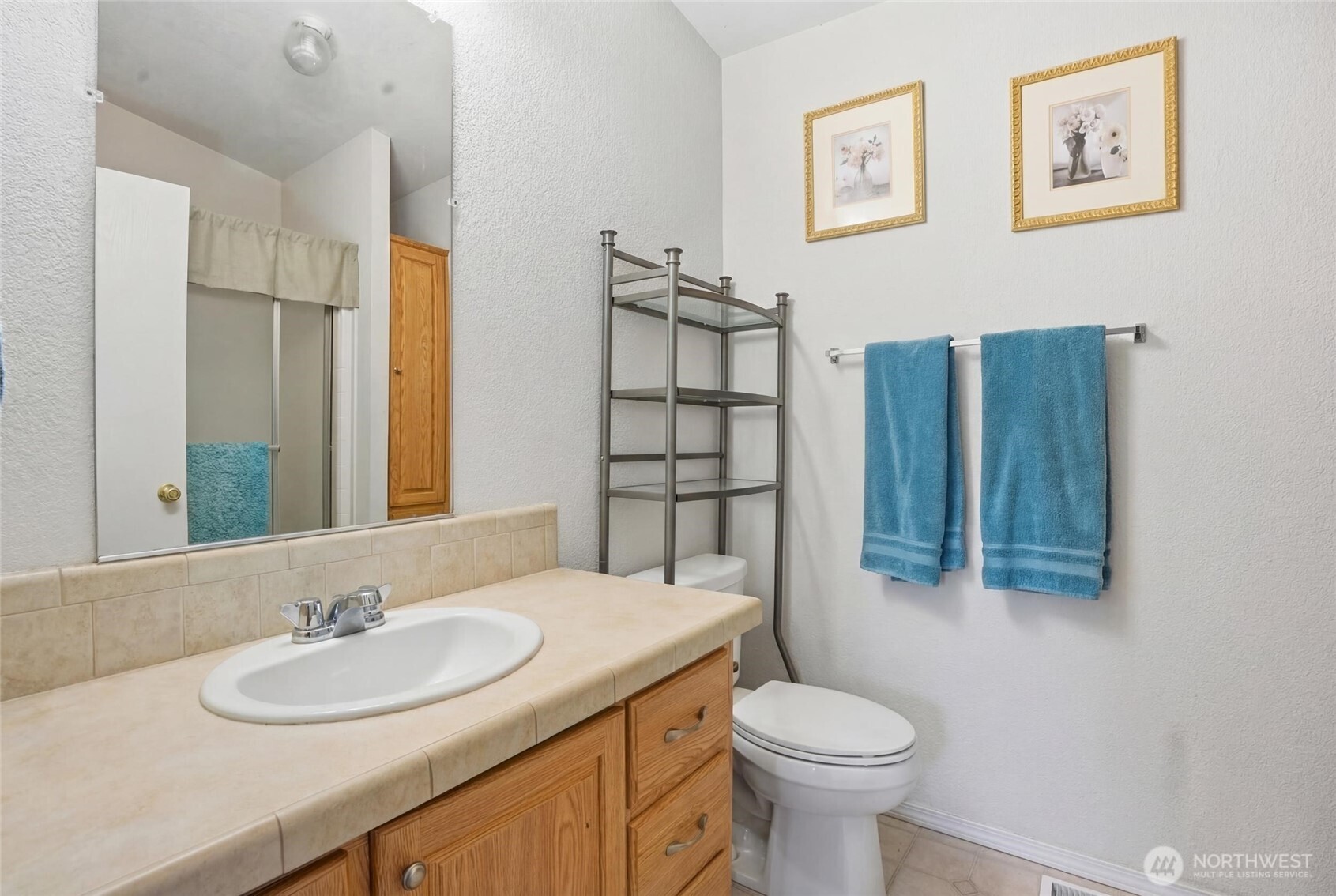 1003 Lord Street Kelso, WA 98626 - Photo 21 of 29 a bathroom with a sink toilet and shower